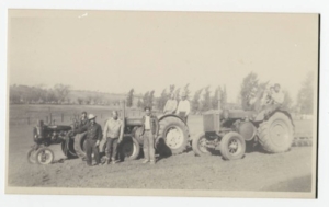 Francisco (right) and Juan (left) Marquez in front of their tractors with their family and employees. The brothers purchased adjacent properties on Dice and Los Nietos Road in Whittier.