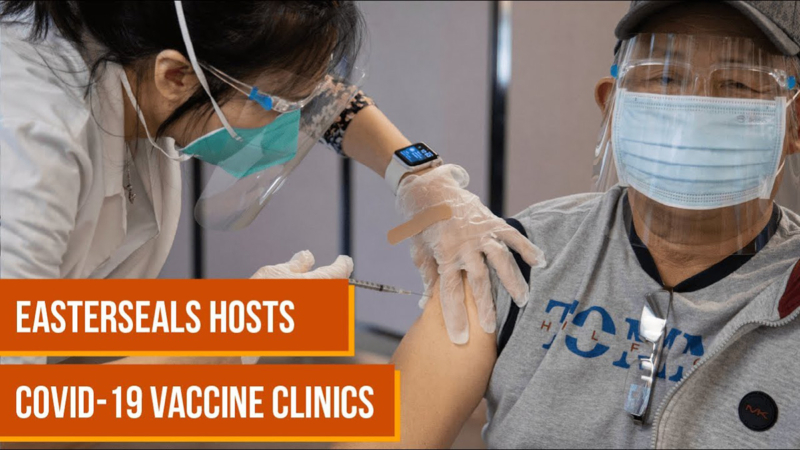 Nurse administering a shot of vaccine into a man's arm.